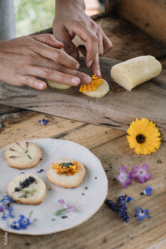 Anonymous Woman Making Fresh Shortcrust Cookies With Flowers