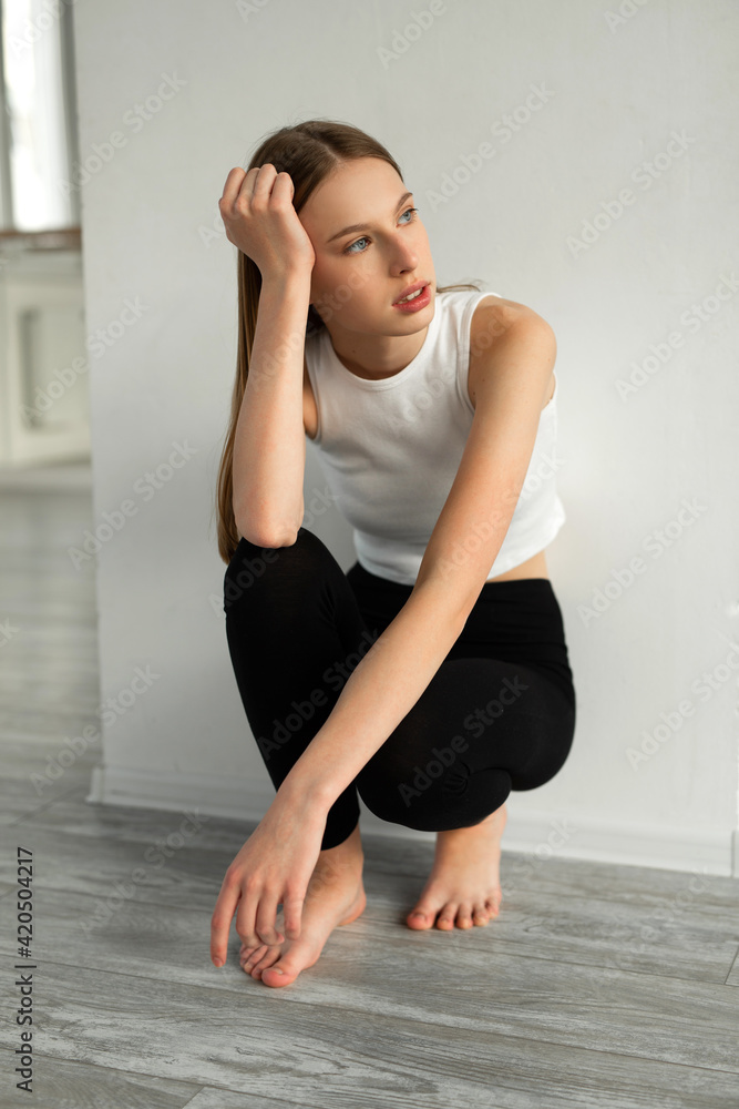 portrait of a beautiful young woman in sportswear portrait of a beautiful young woman in sportswear