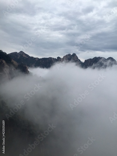 China Mount HuangShan - April  2015  Natural scenery  sunsets  peculiarly-shaped granite peaks  Huangshan pine trees and views of the clouds from above. Photo taken in Yellow Mountain  UNESCO .