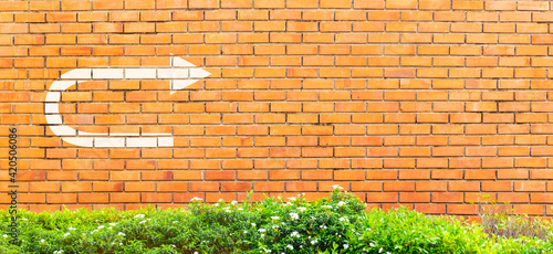 White turnaround sign or U tune sign on vintage brick wall, Decision making concept