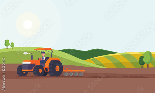 Tractor plowing a field for planting crops. Agriculture