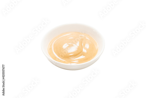 Mushroom sauce in a bowl isolated on white background.