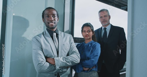 Multi-ethnic business people looking to the camera photo