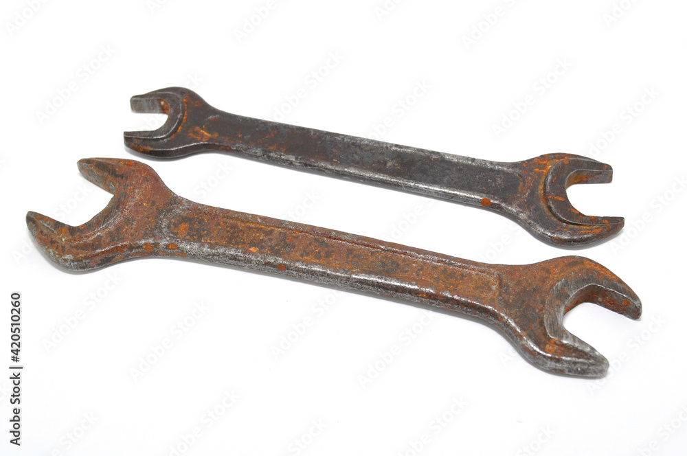 Rusty wrench on white background close-up. Tool, old, rare