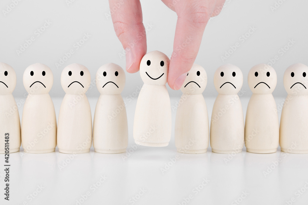 Wooden man with icons showing emotions and scores. Excellent business rating. Concept of satisfaction survey and customer services experience. Wooden man with icons showing emotions and scores. Excellent business rating. Concept of satisfaction survey and customer services experience.