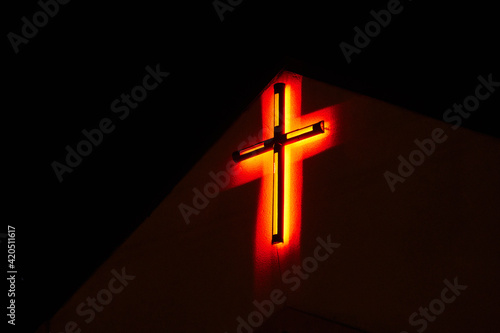 lonely red neon cross photo