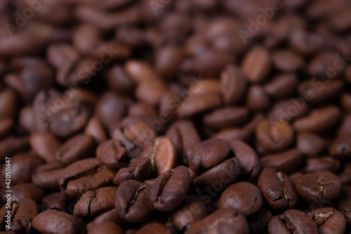 close up of Freshly roasted coffee beans background. top view
