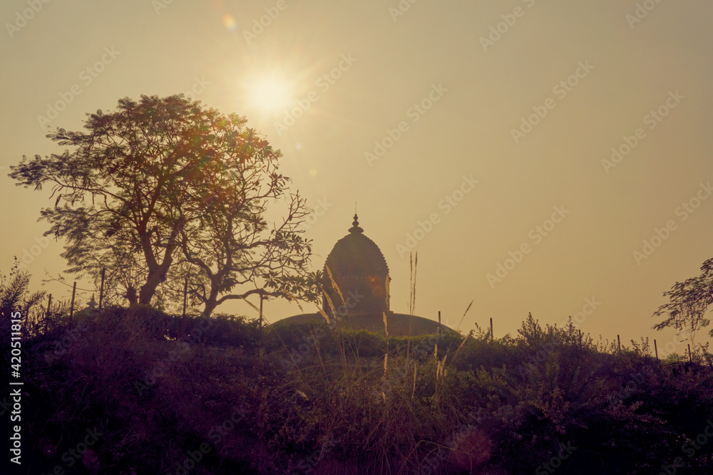 Jor Mandir (twin) temple of Bishnupur. an ancient terracotta temple in West Bengal. A famous historical tourist place. Silhouette of the temple during dusk.