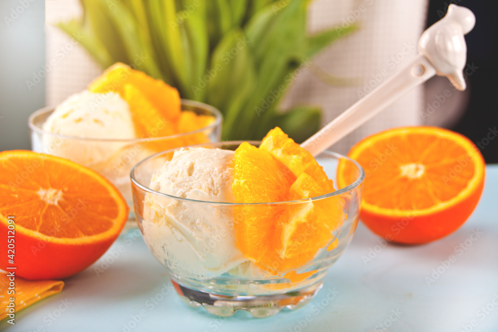 Homemade fresh orange ice cream with orange slices. Summer dessert. Homemade fresh orange ice cream with orange slices. Summer dessert.
