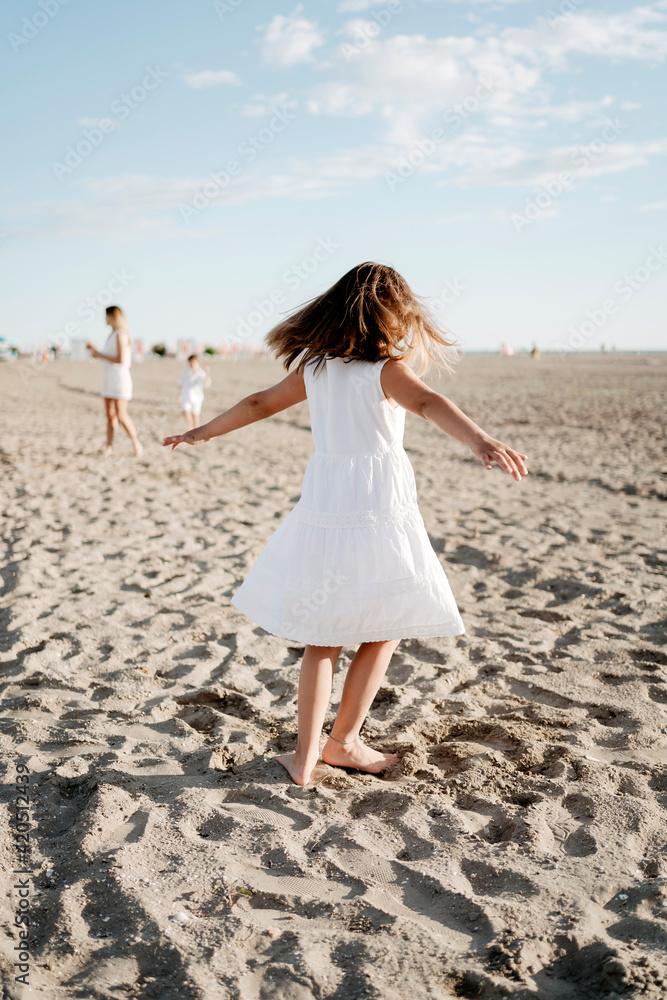 Family portraits. Kids playing on the beach in summer Family portraits. Kids playing on the beach in summer