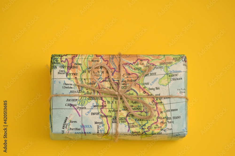 Fototapeta premium Map Paper Travel Concept with Gift Box