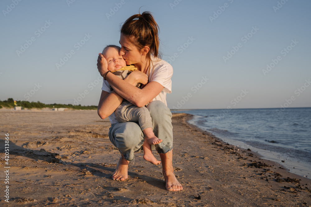 Mother And Baby In The Beach