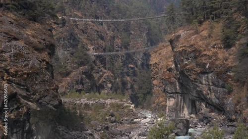 A view of the Tenzing Hillary swinging bridge in the mountains of Nepal zoom in. photo