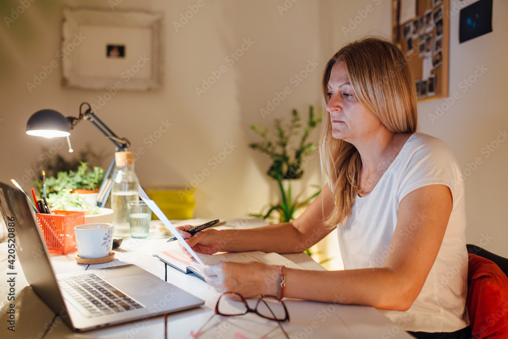 Woman Sitting At A Desk, Working From Home Woman Sitting At A Desk, Working From Home