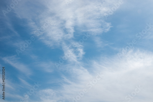 cold blue sky with white clouds