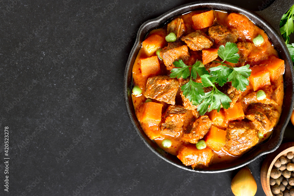 Beef stew with potatoes and carrots in tomato sauce Beef stew with potatoes and carrots in tomato sauce