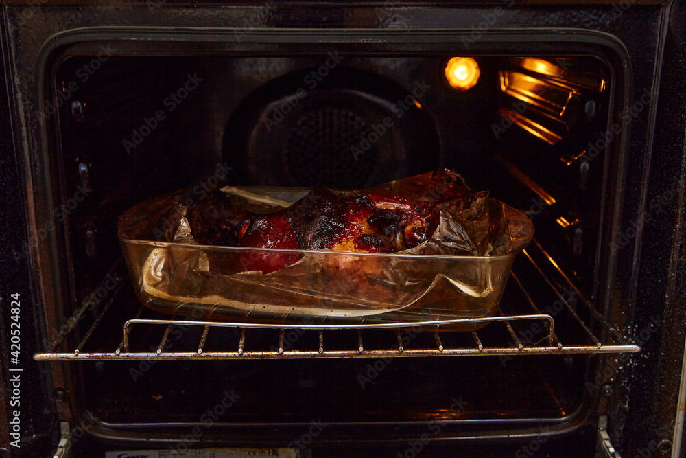 Delicious pork knuckle on the baking tray out of the oven. Delicious pork knuckle on the baking tray out of the oven.