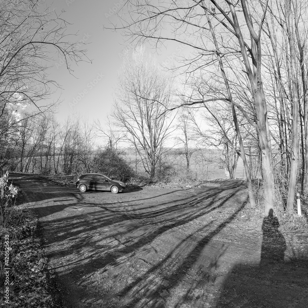 Nechranice, Czech republic - February 28, 2021: little parking place with Opel Astra at spring sunset