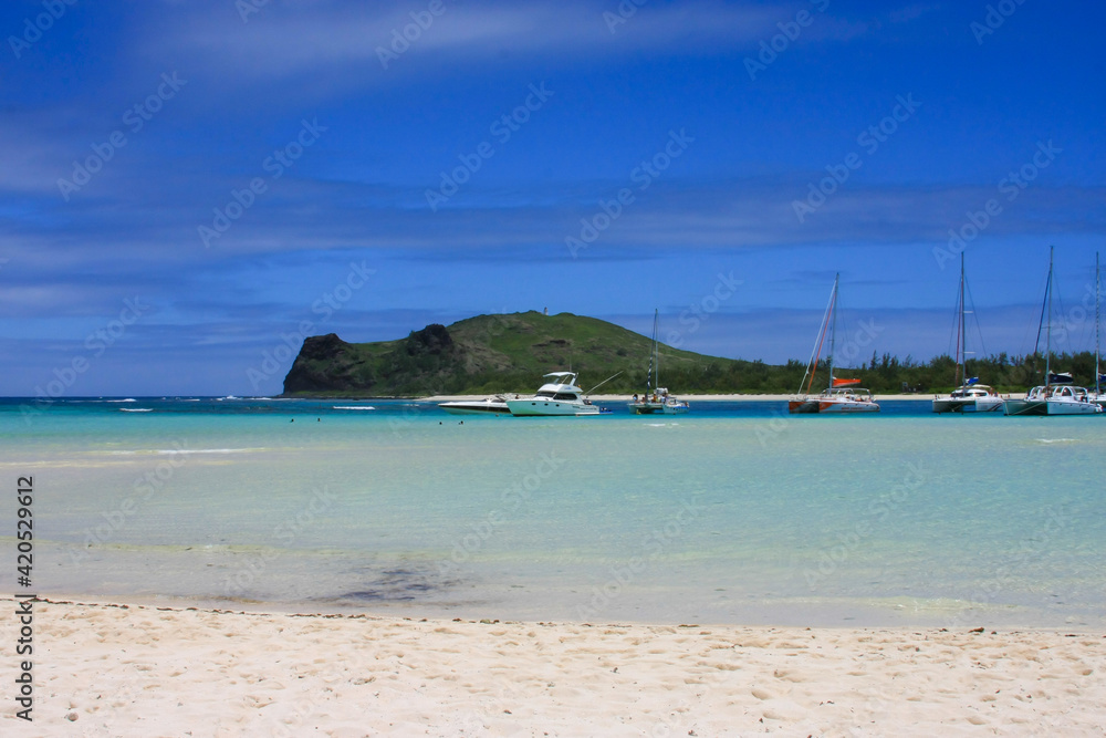 Beautiful beach with boats in Mauritius. Beautiful beach with boats in Mauritius.