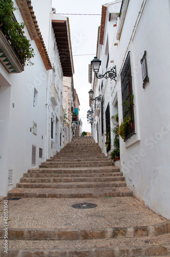 ALTEA, SPAIN - AUGUST 11, 2012: The maze of cobbled narrow and crooked streets in Altea town. © Ross