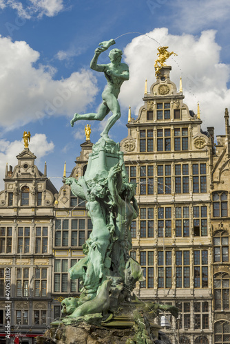 Guildhouses at the Grote Markt and Statue of Brabo and the giant's hand in Antwerp, Belgium photo