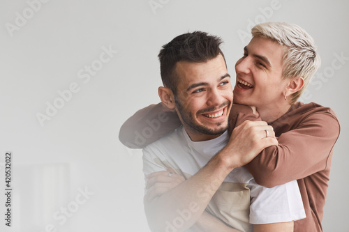 Portrait of Carefree Gay Couple Indoors photo