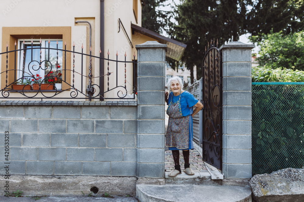 Grandma waiting for someone outdoors Grandma waiting for someone outdoors