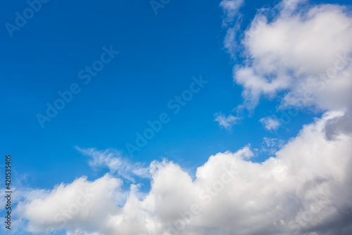 Landscape of a beautiful blue sky covered with cumulonimbus clouds on a winter afternoon. Unspoiled nature.