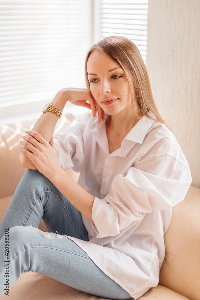 Woman indoor portrait. Young beautiful girl at home Woman indoor portrait. Young beautiful girl at home