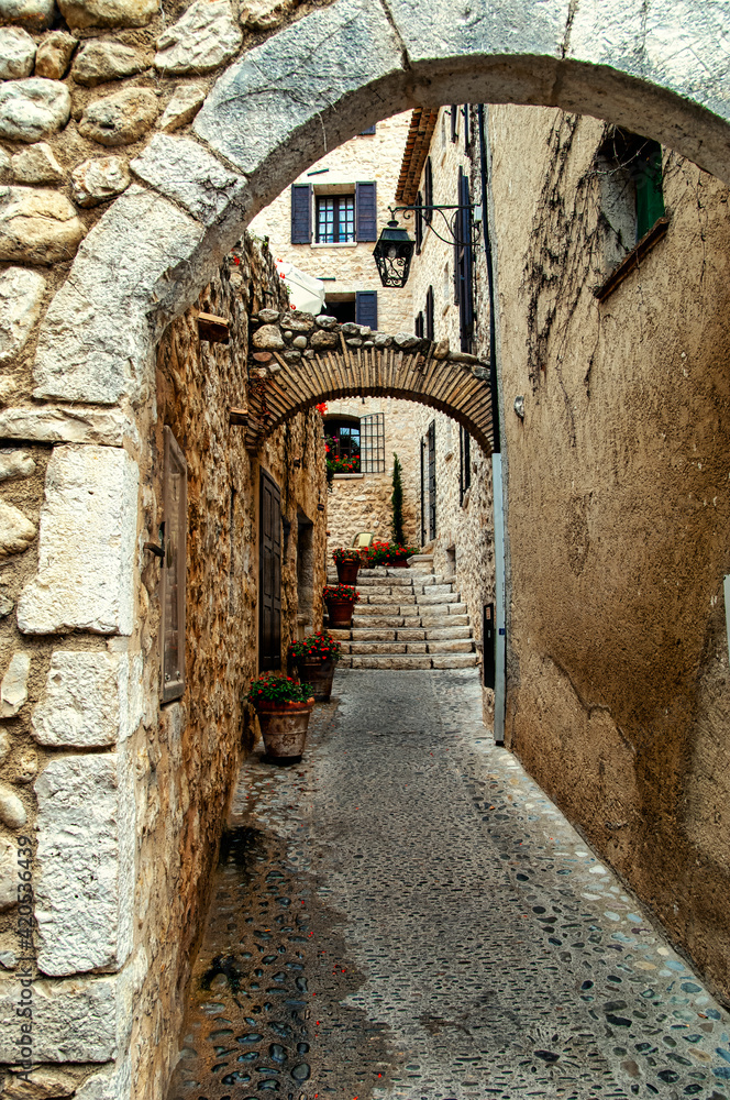 A narrow medieval alley in the old town of Avignon, France