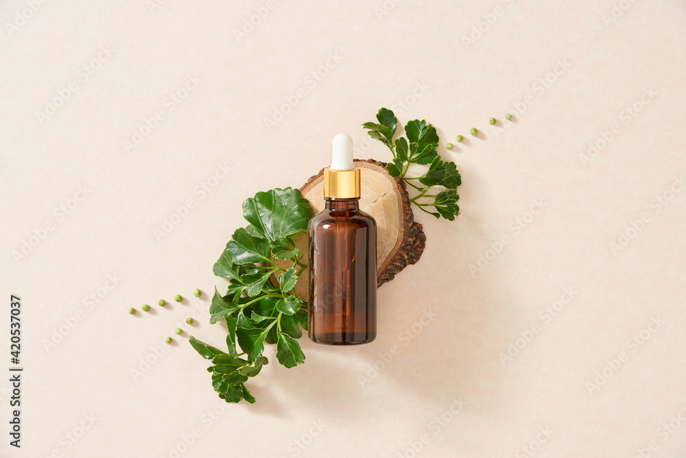 © Maki Company Limited/Stocksy - Flatley .essential oil. Aromatic oil. essential oil with a flower and fresh medicinal herbs on a white background