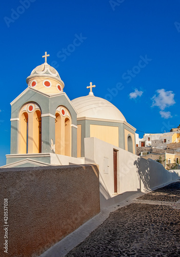 A church dome and steeple in Santorini Greece