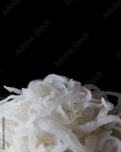 shredded pork closeup isolated on black
