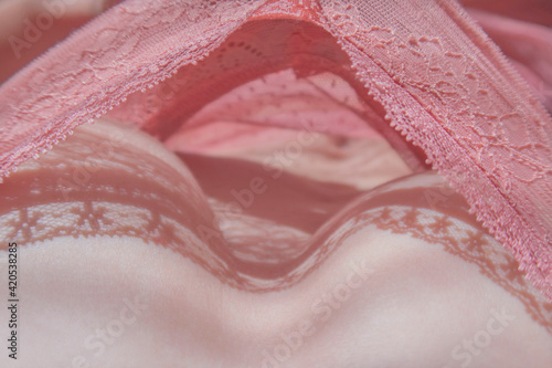 delicate breasts in pink lace underwear closeup