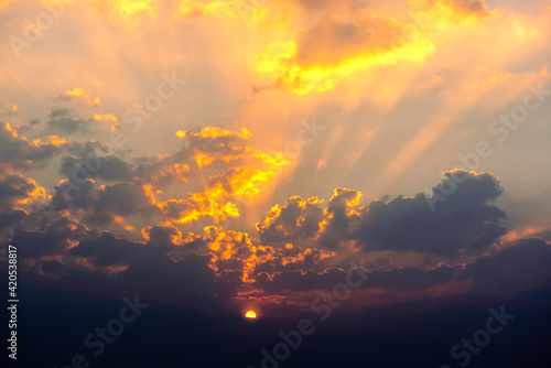 Beautiful sunrise and clouds with sun ray on the sky for natural background.