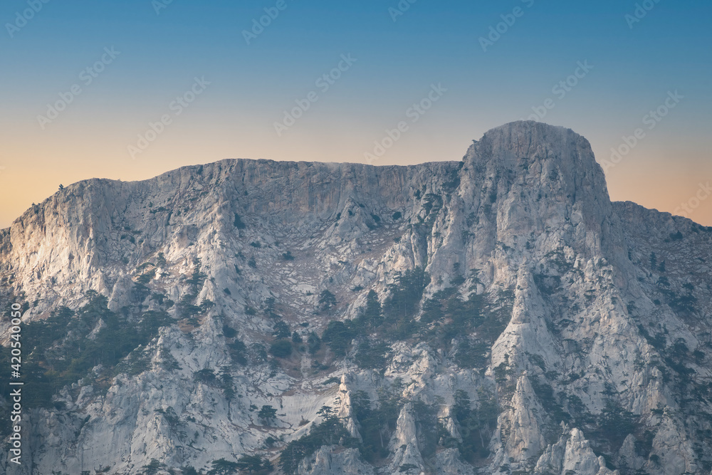 A majestic view of the rocky mountains ranges in beautiful clear sunset A majestic view of the rocky mountains ranges in beautiful clear sunset