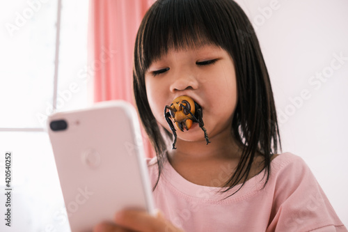 cute girl with a hornet in mouth