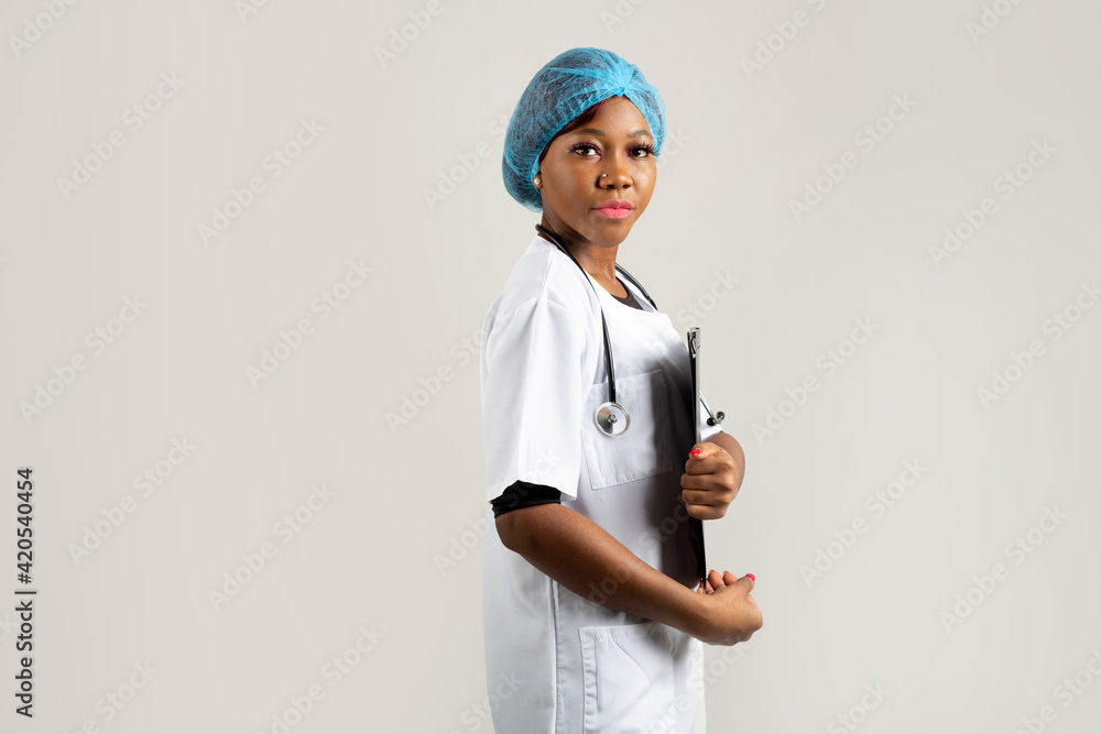 beautiful young african woman in a medical gown on a white background beautiful young african woman in a medical gown on a white background