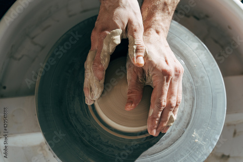 Professional man using mechanic pottery made earthenware