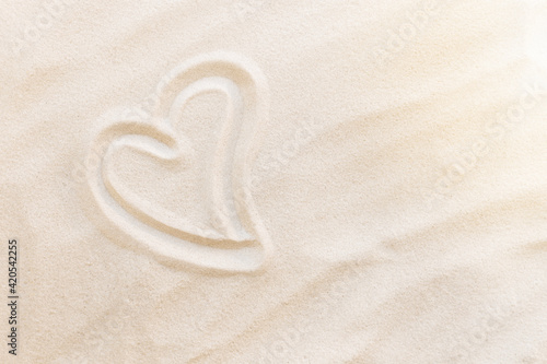 Travel, vacation, honey moon concept. Heart shapes on the sand. Love for two