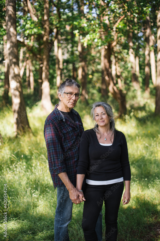 Portrait of mature, smiling couple enjoying time together outsid Portrait of mature, smiling couple enjoying time together outsid