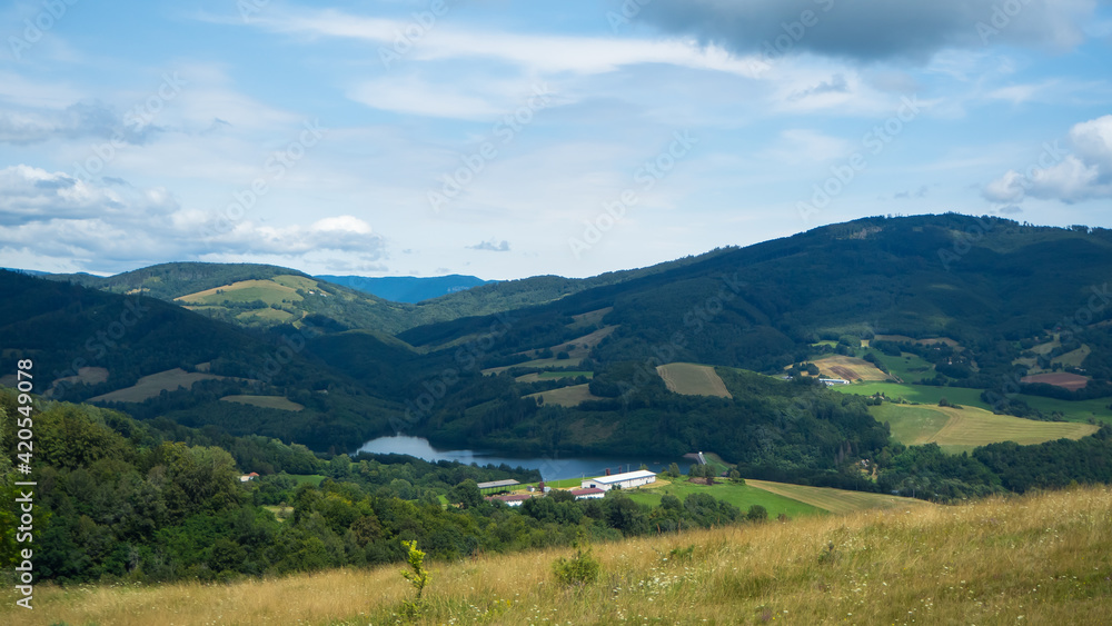 View of the valley with a large lake. View of the valley with a large lake.