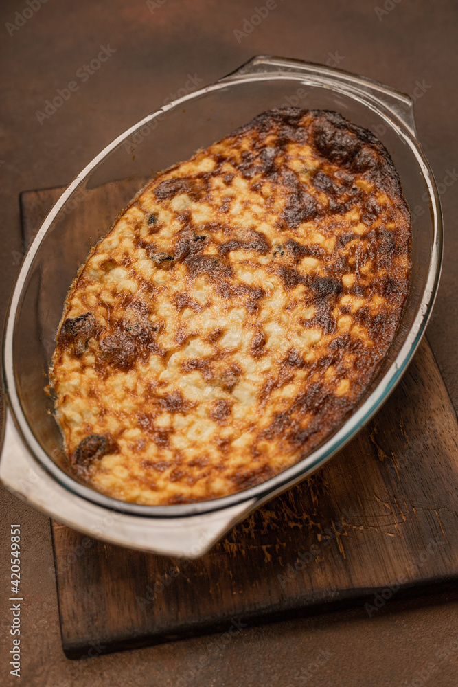 Freshly baked curd pudding in a baking dish Freshly baked curd pudding in a baking dish
