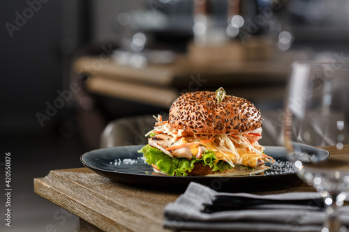 Chiken Burger with coleslaw on wooden table