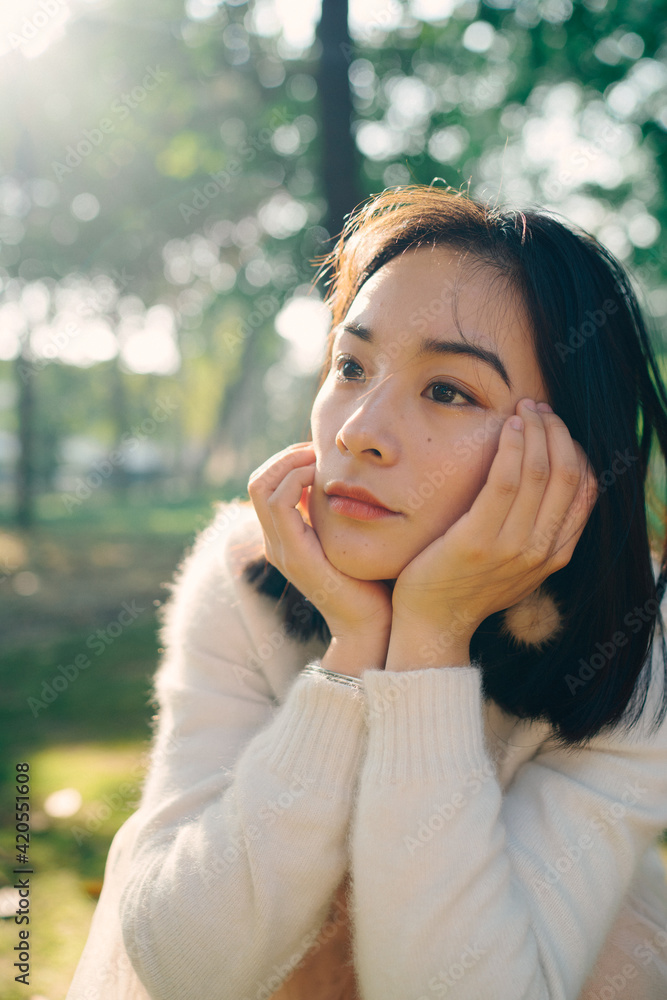 portrait of Chinese young woman in forest garden portrait of Chinese young woman in forest garden