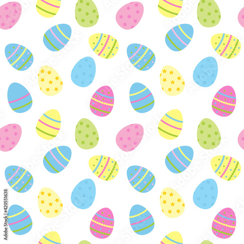 Seamless Easter pattern. Texture with colored eggs isolated on white. Spring childrens background in pastel colors. Festive wrapping paper.