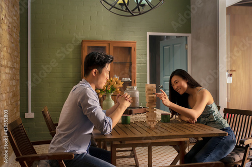 Couple playing Tumbling Towers