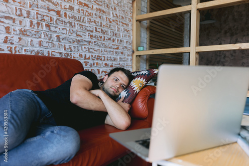 Man resting after hard day in living room