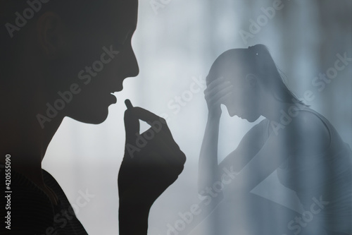 Woman swallowing medication pill. People drug addiction, sickness and mental depression concept.  photo