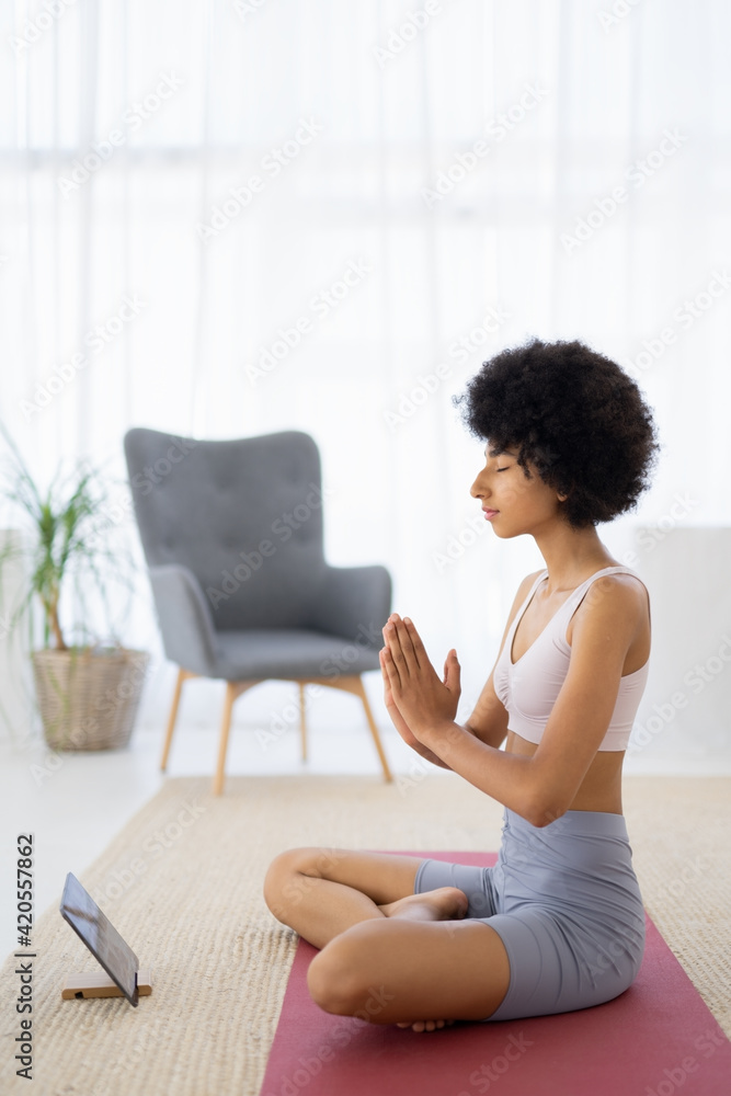 Close up of Woman in Sportswear is Meditating in Lotus Position. Close up of Woman in Sportswear is Meditating in Lotus Position.